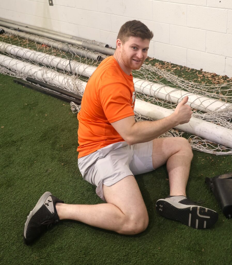 Benji Kaiserman cleans in the Indoor Practice Facility.
