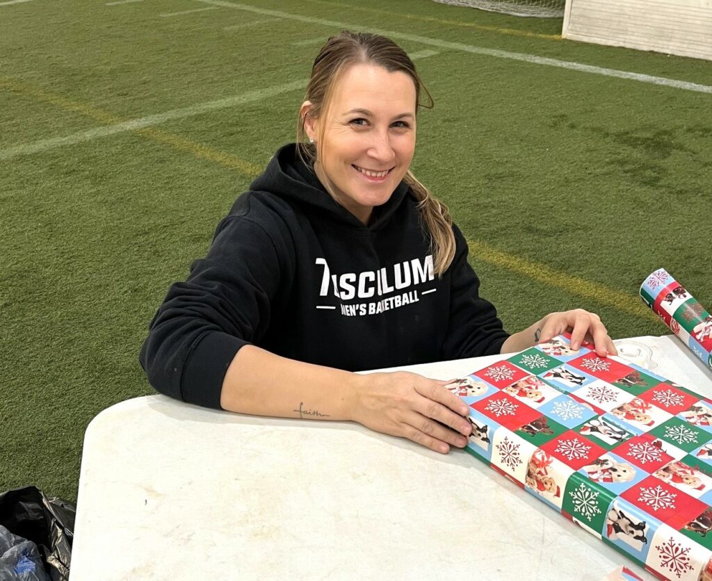 Trinity Velasco wraps a gift.