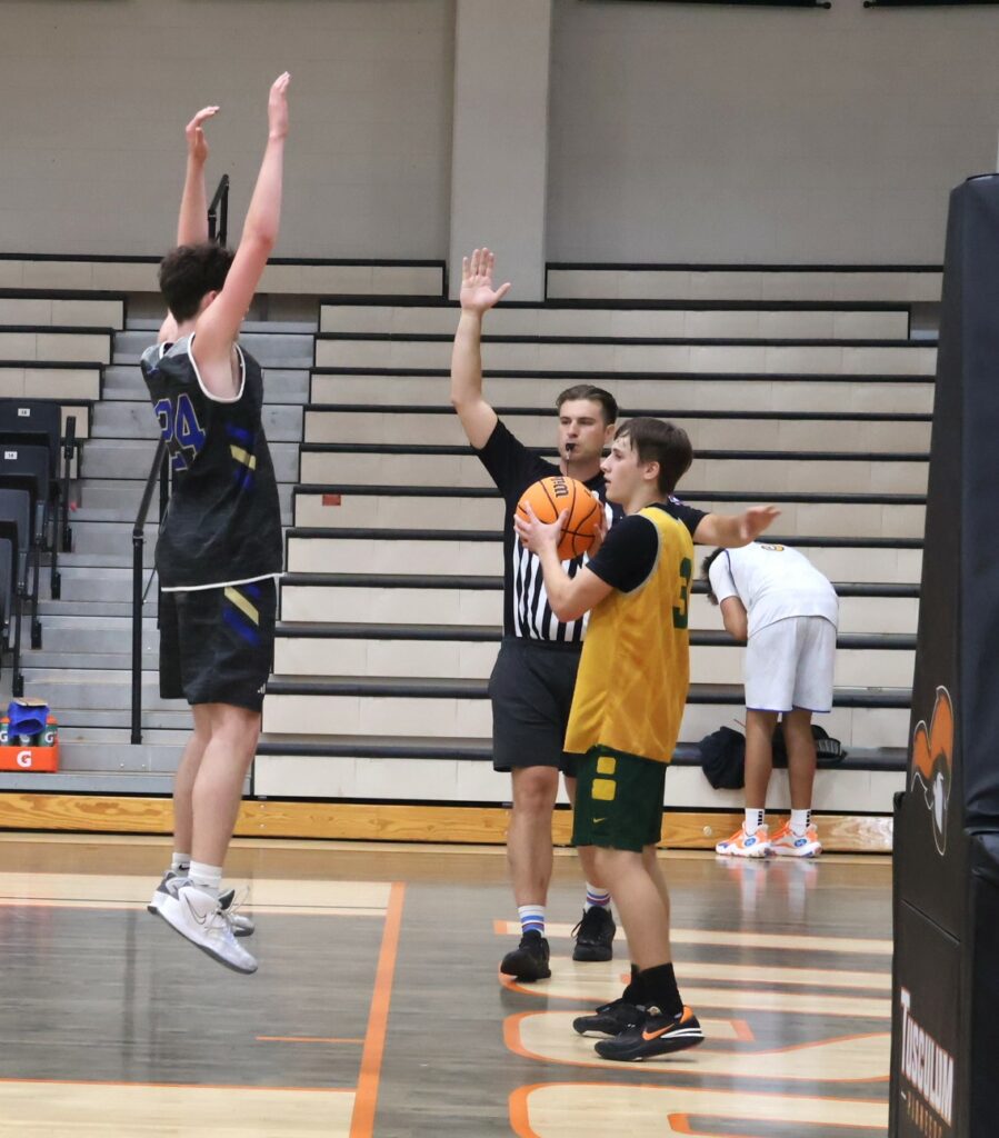 A defender tries to create havoc during the inbounds play.