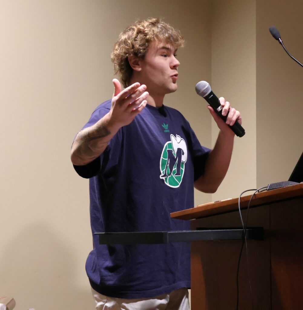 A student shares his view during the debate.