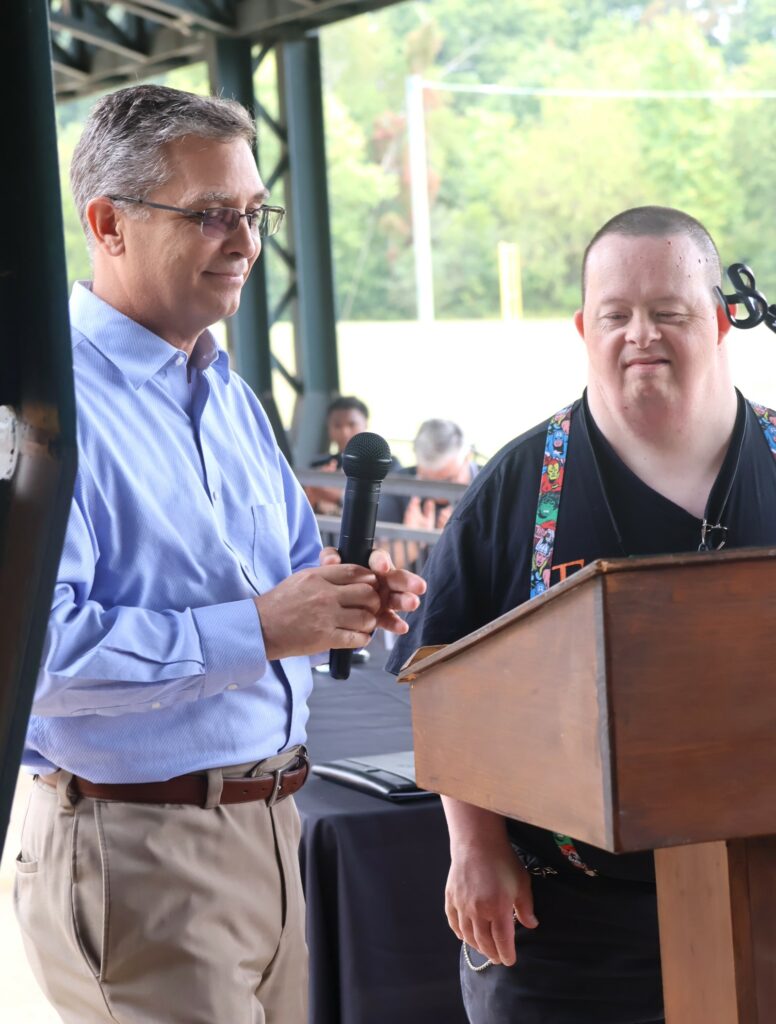 Dr. Hummel, left, honors Travis Parton.