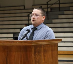 Mike Brisbin, Tusculum's men's lacrosse coach, speaks at the service