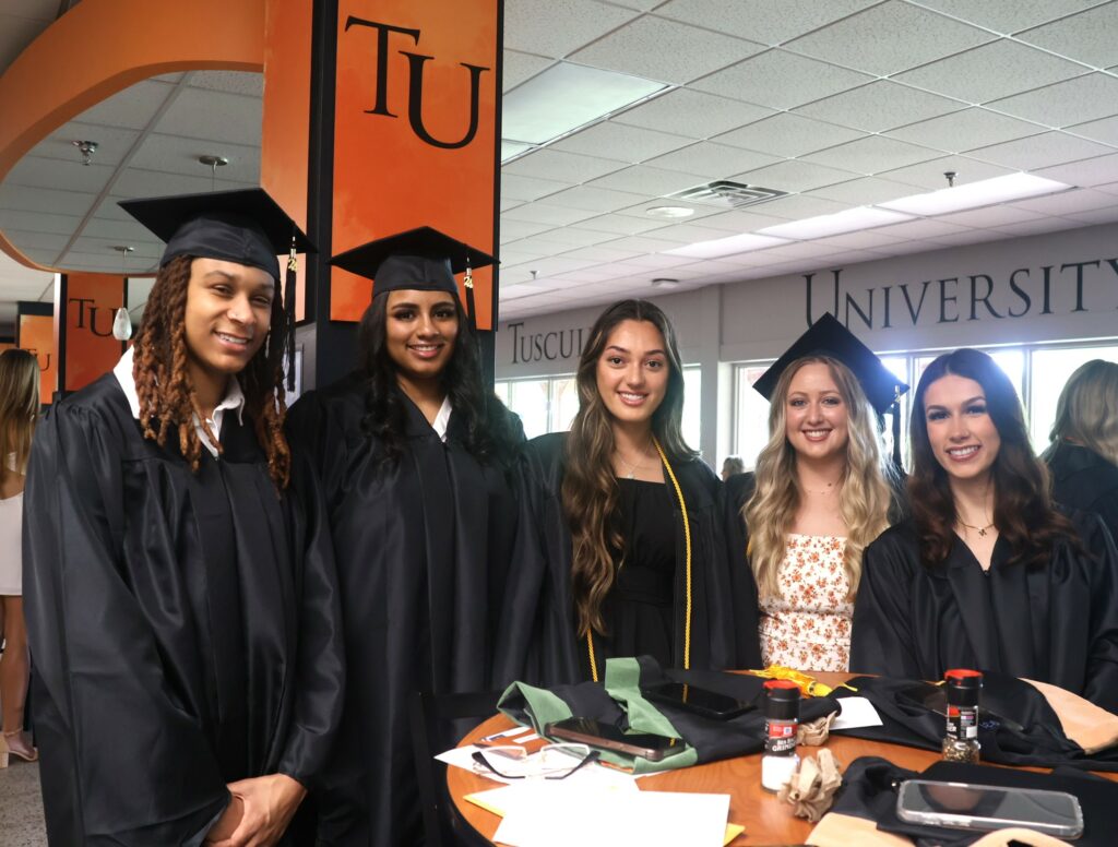 These graduates prepare to become alumnae.