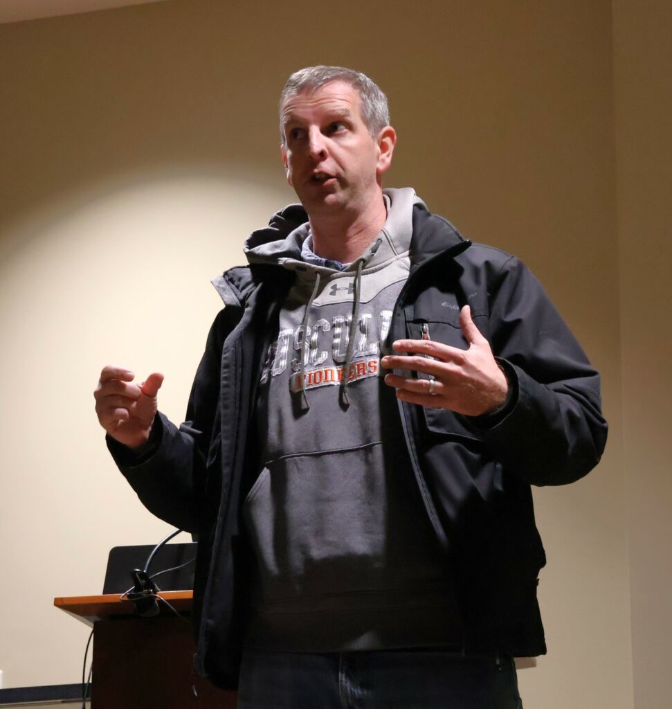 Dr. Kurtis Miller speaks at the conclusion of the debate.