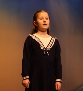 Maggie Hall, one of the actresses who plays Pollyanna, performs a scene.