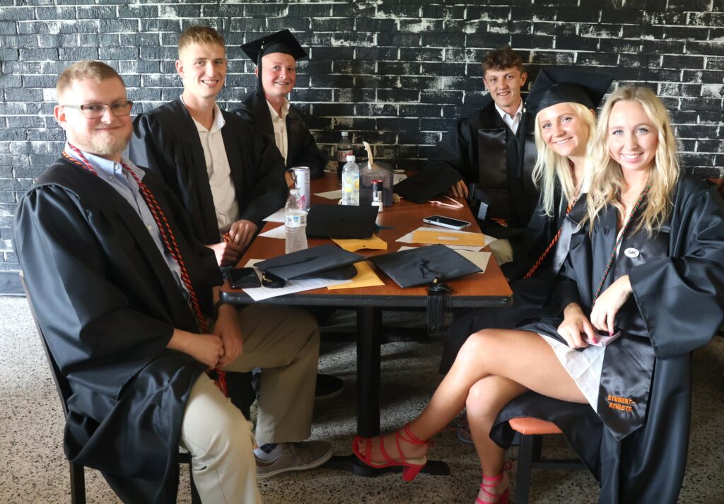 These graduates prepare to become alumni.