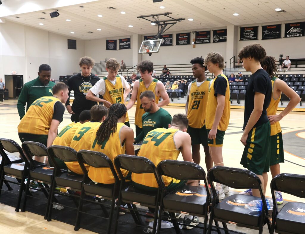 A team prepares its strategy for the next part of the game.