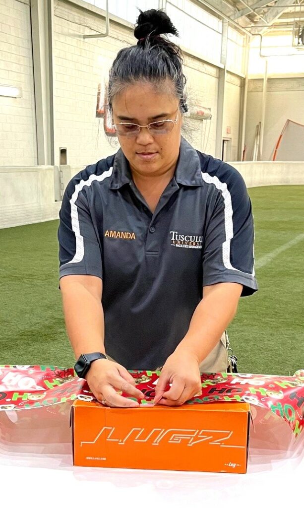 Amanda Anderson wraps a gift.