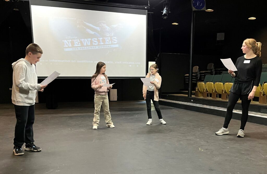 Potential cast members audition for "Newsies."