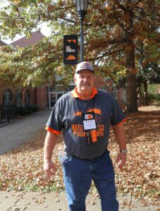 David Misener spends time in front of the Scott M. Niswonger Commons.