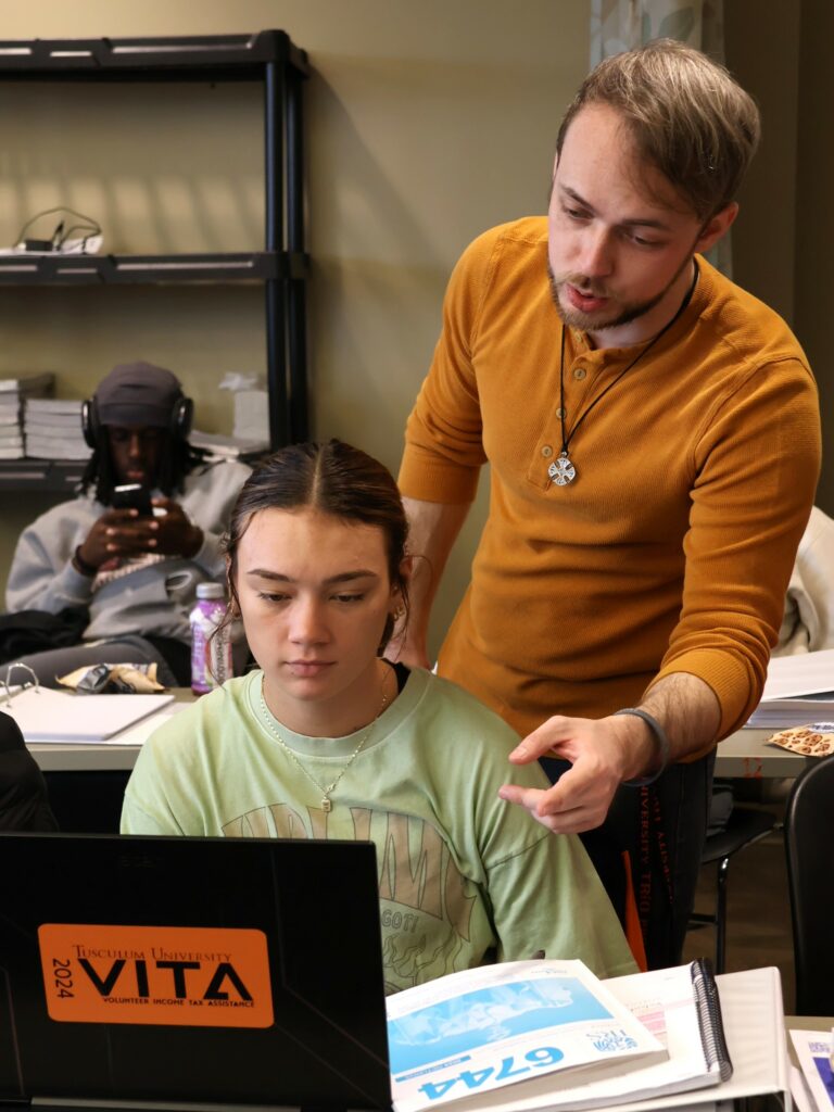 Students participate in training to prepare income tax returns.