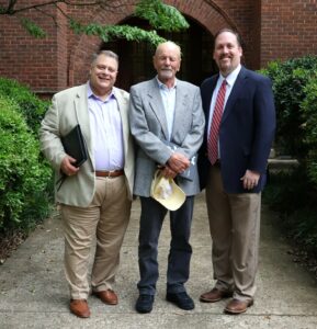Left to right, Edward Roberts, David Nyholm and Dr. David Cook take a photo together outside McCormick Hall.