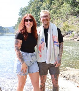 Dare Crusade, left, and his wife, Jessica, celebrate after the baptism.