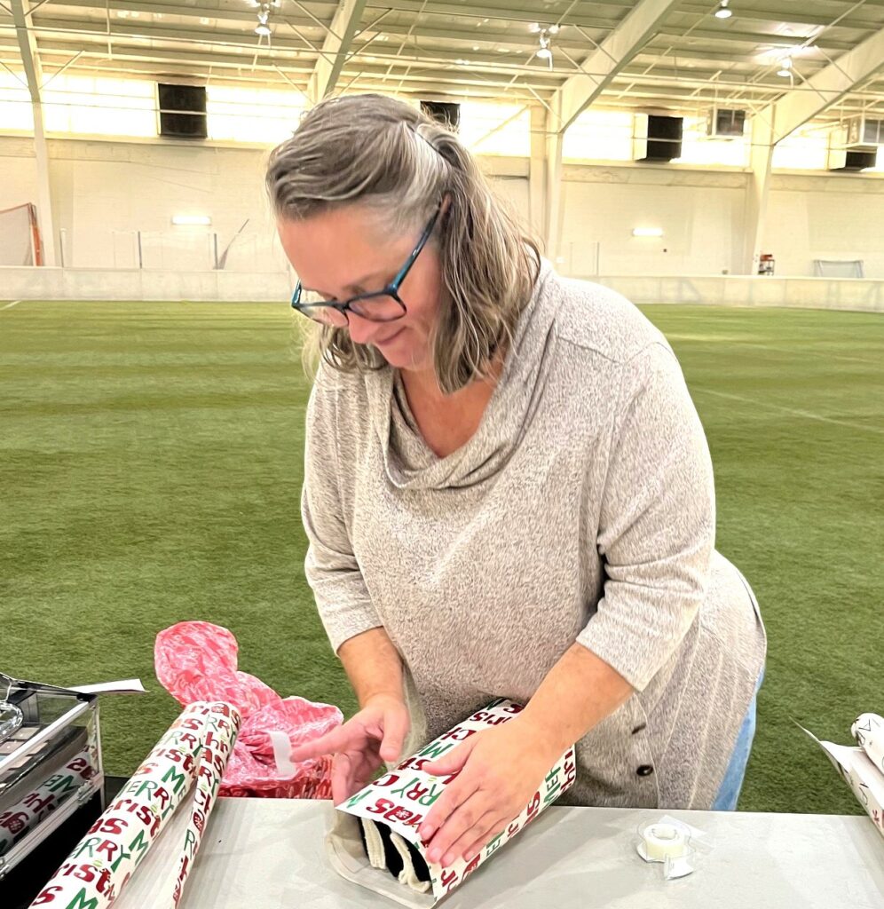 Jenni Bowman wraps a gift.