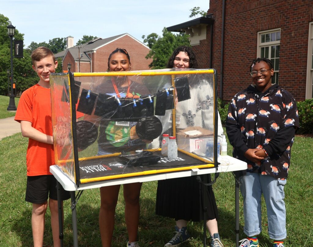 Students show a project they completed in their forensics class.
