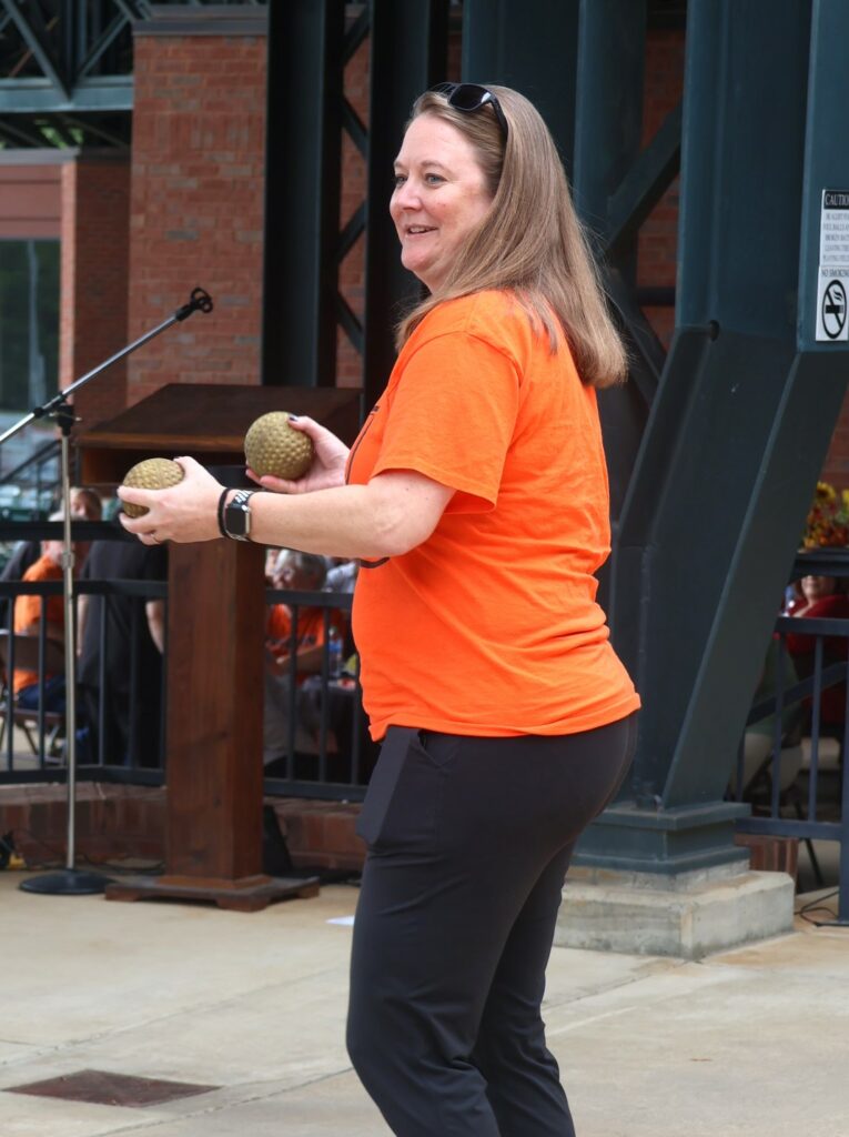 Carrie Maggert prepares to throw a ball to dunk Dr. Suzanne Byrd.