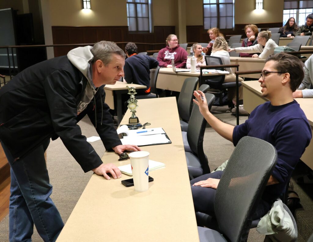 Dr. Kurtis Miller, left, and Dr. Josh Miller consult as the judges in this competition.