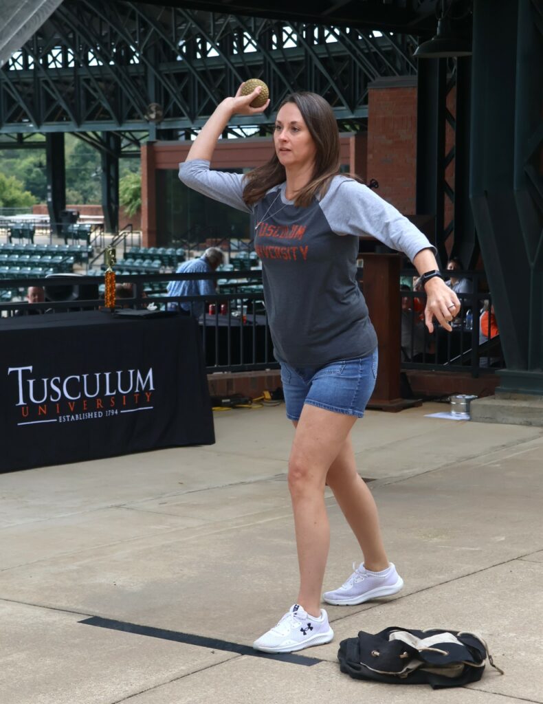 April Lane throws a ball during the dunking booth activity.