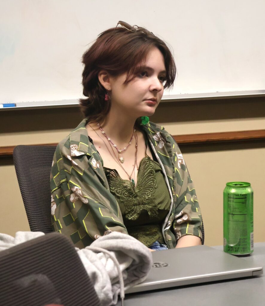 A student listens to Kassidy Babler teach the witch hunting class.