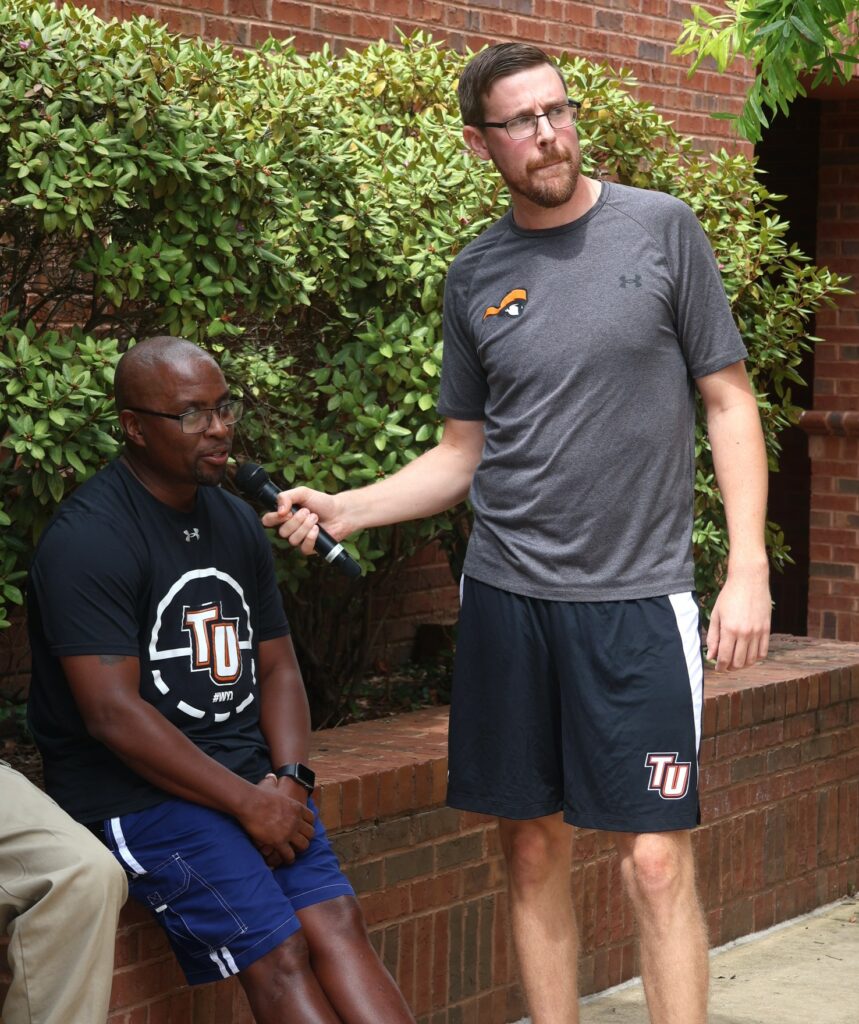 Justin Chartrand, right, interviews J.T. Burton about Burton's upcoming appearance in the dunking booth. Burton contended he would stay dry.