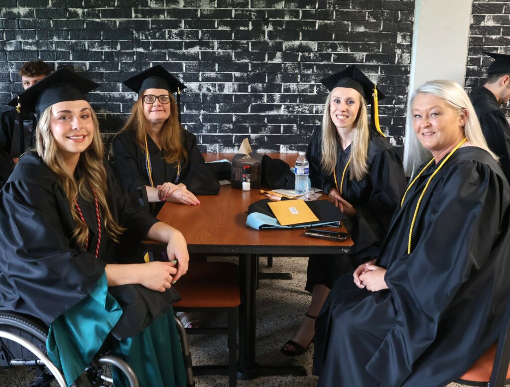Graduates relax before the ceremony.