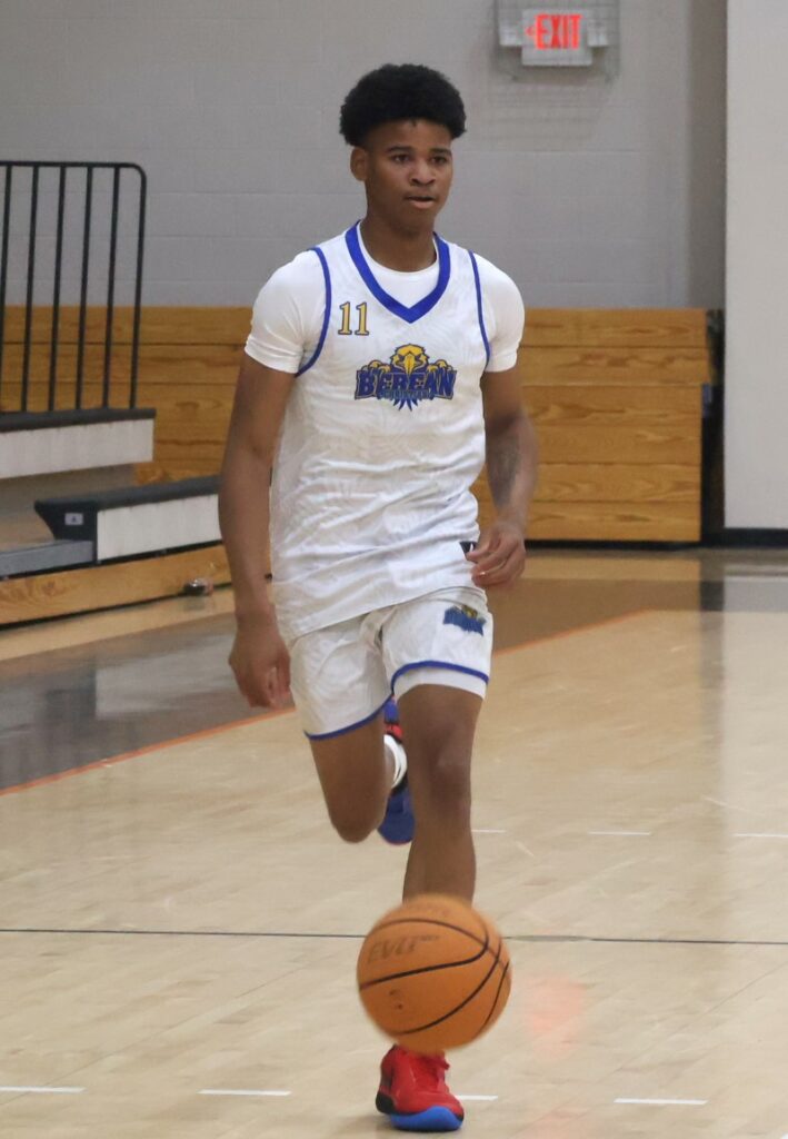 A player brings the ball upcourt.