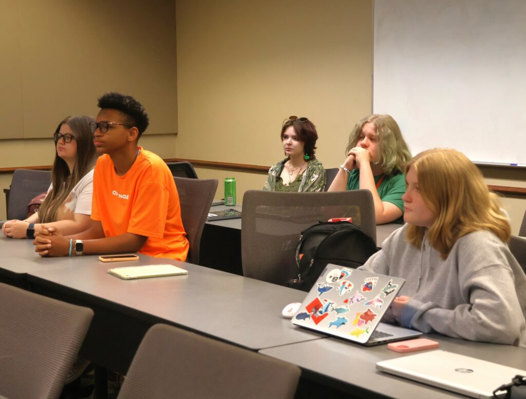 Students listen to Kassidy Babler teach the witch hunting class.