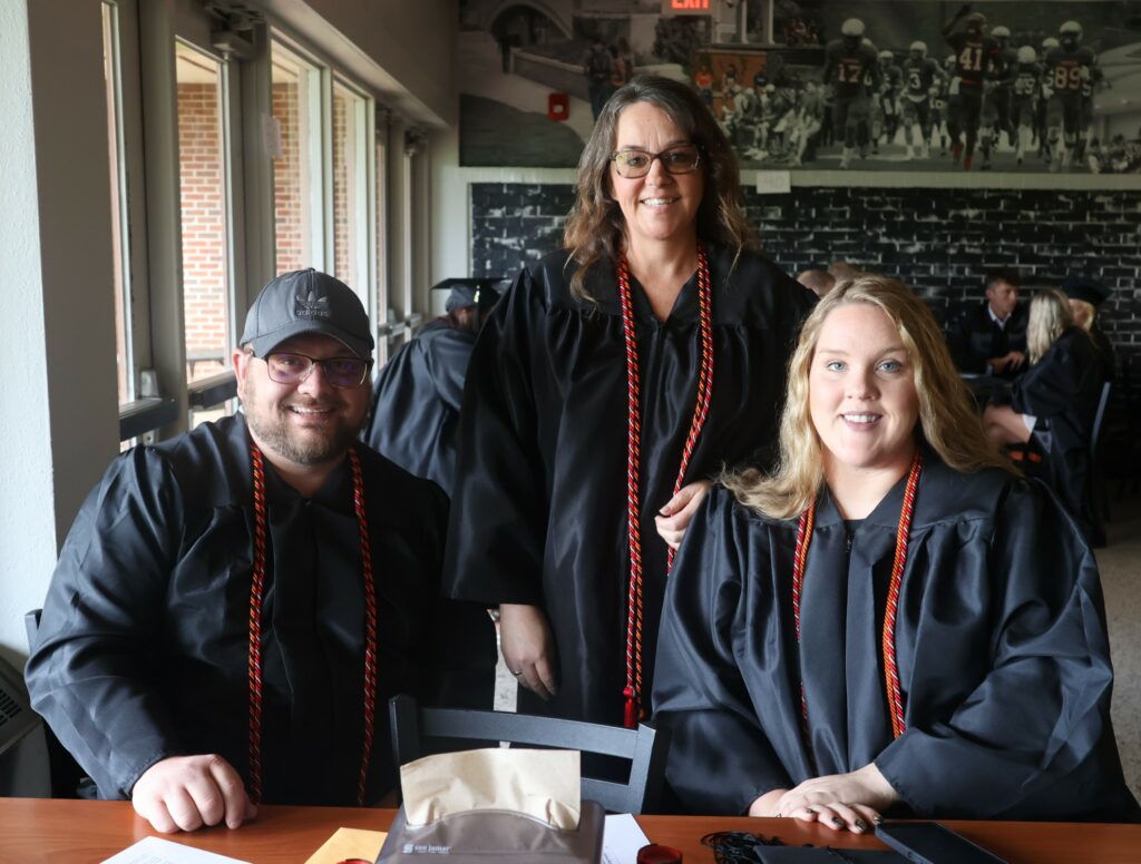 Graduates relax before the ceremony.
