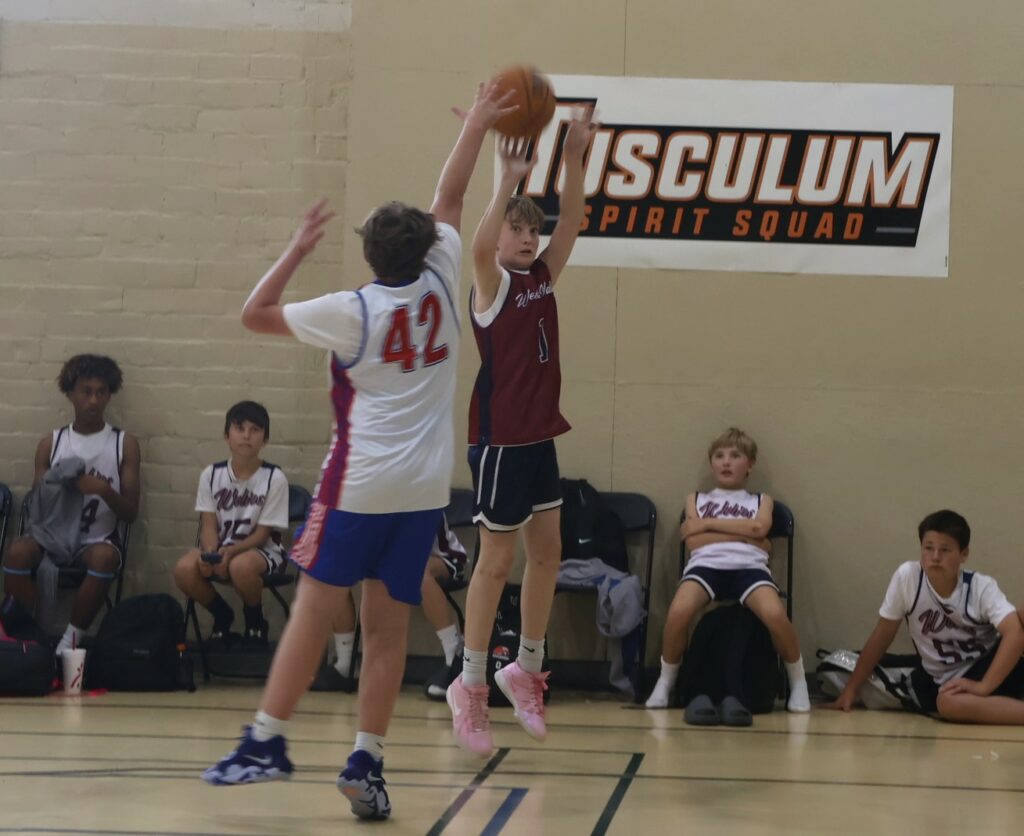 A player shoots the ball.