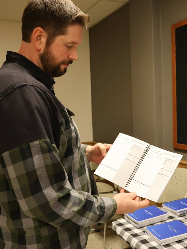 Dr. Chris Shumate looks at one of the journals..
