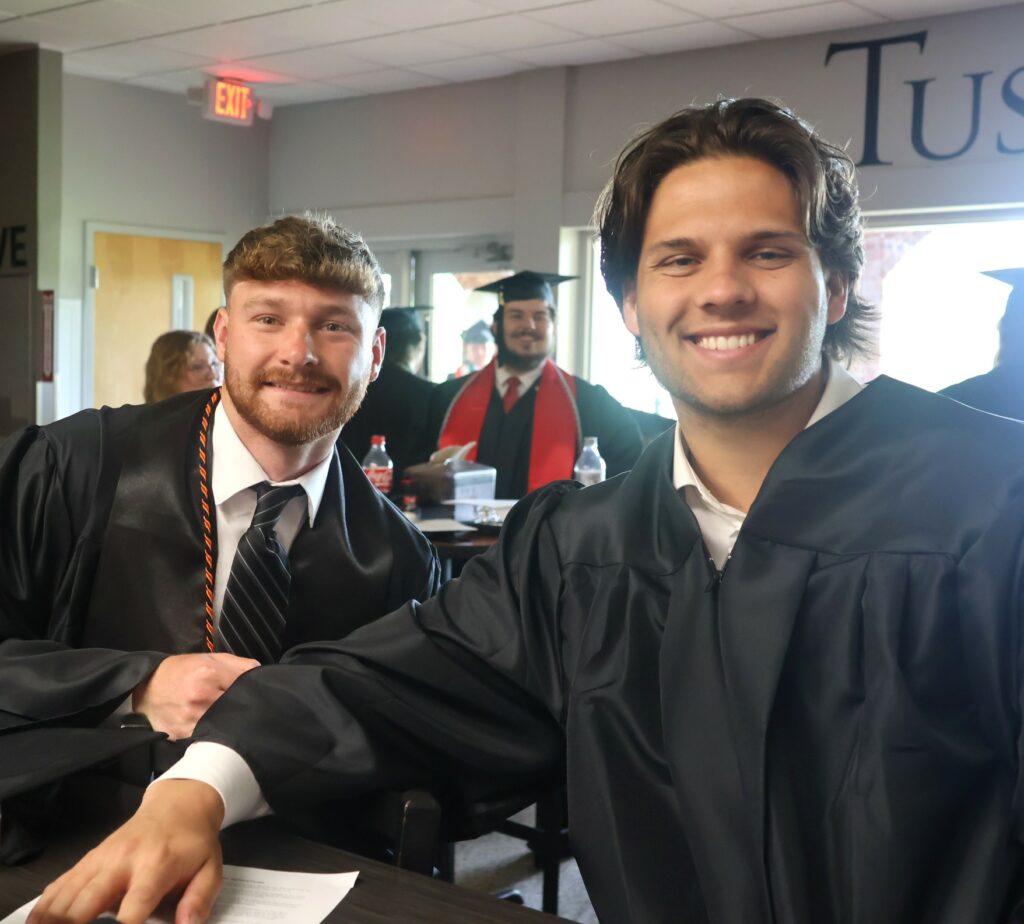 Graduates relax before the ceremony.