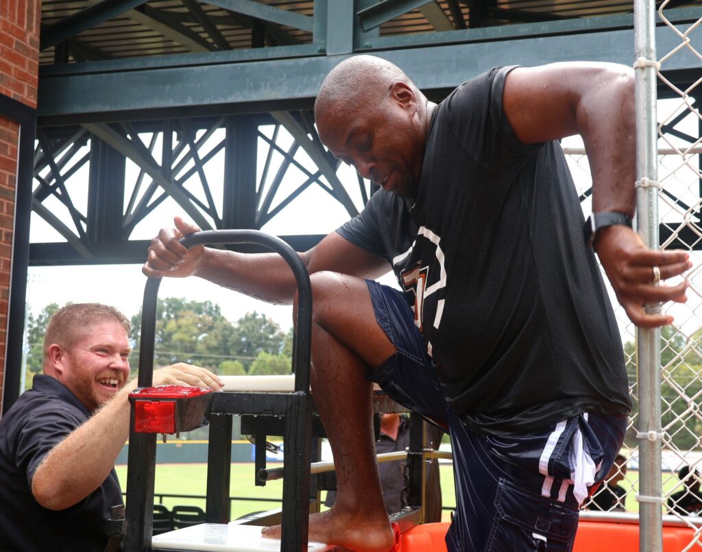 J.T. Burton returns to the seat after being dunked.