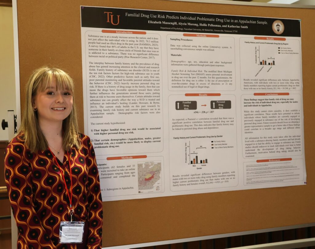 Elizabeth Massengill stands by her poster.