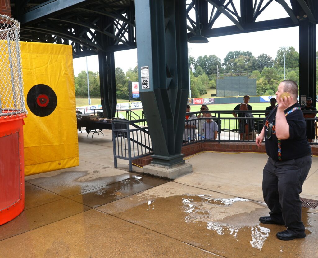 Travis Parton prepares to throw the ball for the dunking booth.