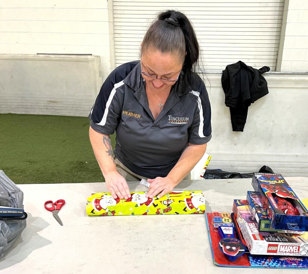 Heather Hensley wraps a gift.