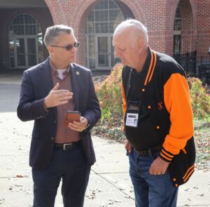 Dr. Scott Hummel, left, speaks with Greg Pielich.