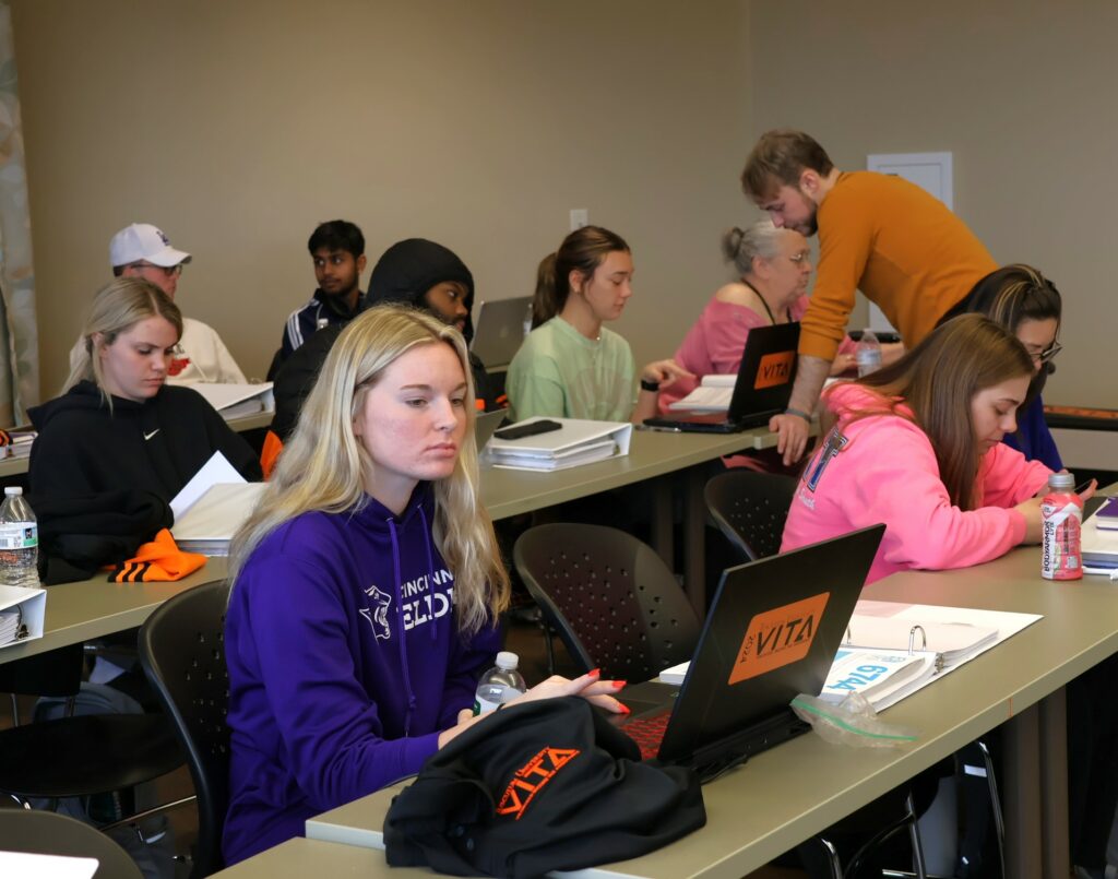 Students participate in training to prepare income tax returns.