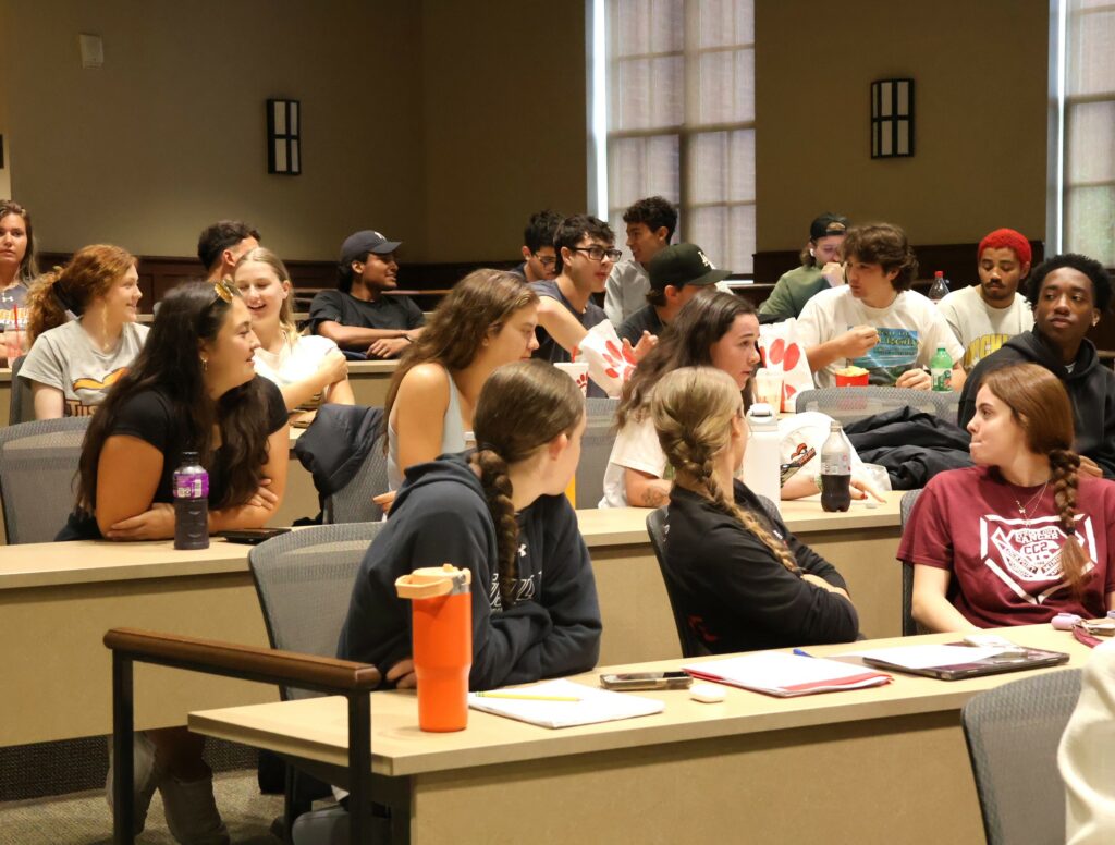 Students on the March Madness side of the debate enjoy the proceedings.