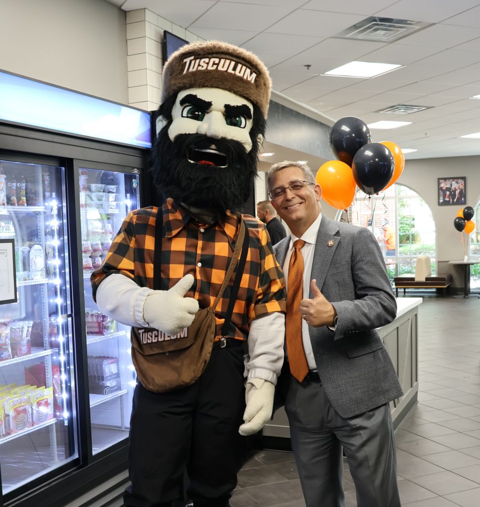 Dr. Scott Hummel, right, and Zeke give the thumbs up.