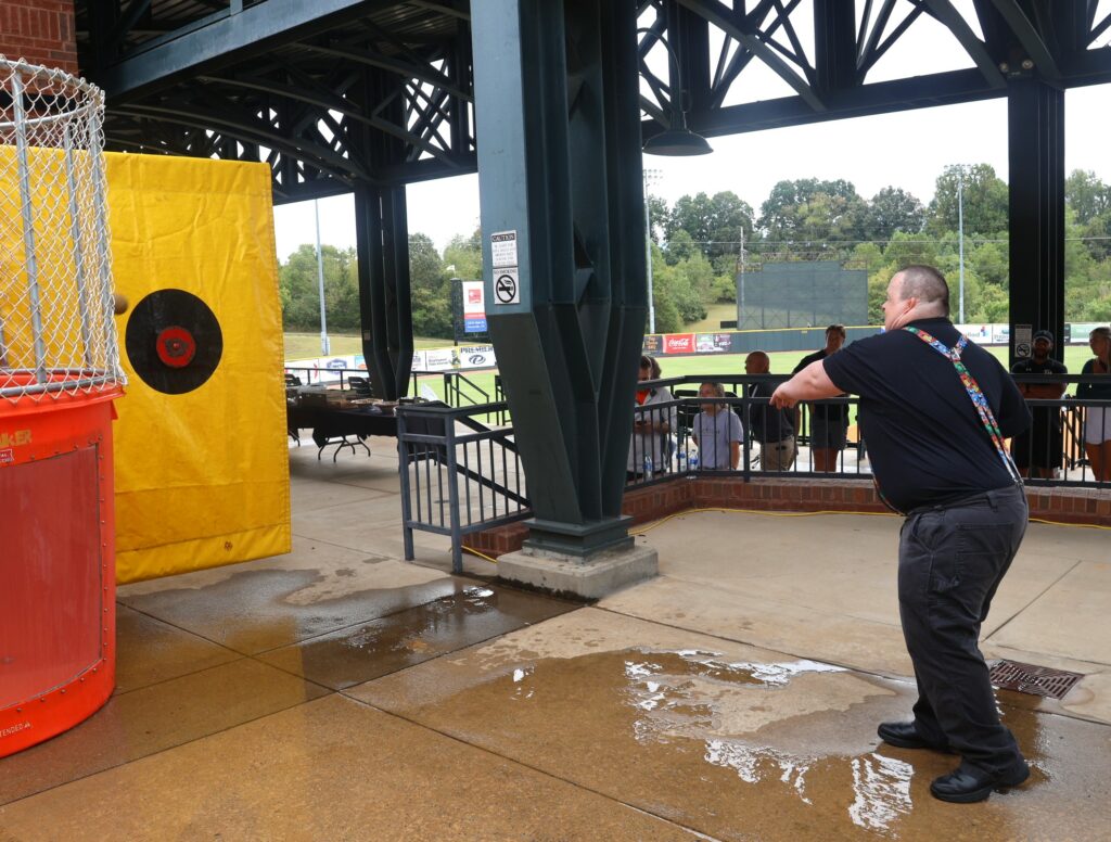 Travis Parton throws the ball for the dunking booth.