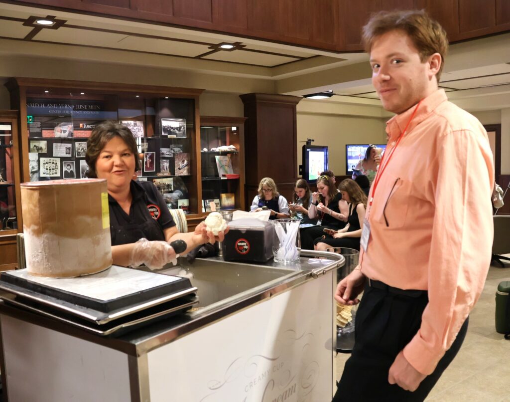 Zach Mitchell, right, gets ready for delicious ice cream from Creamy Cup.
