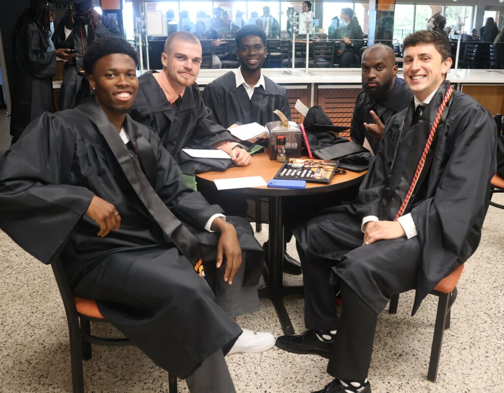 Graduates relax before the ceremony.