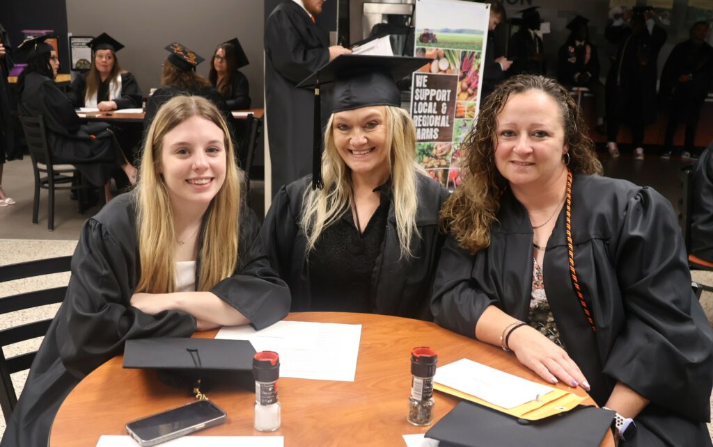 Graduates relax before the ceremony.
