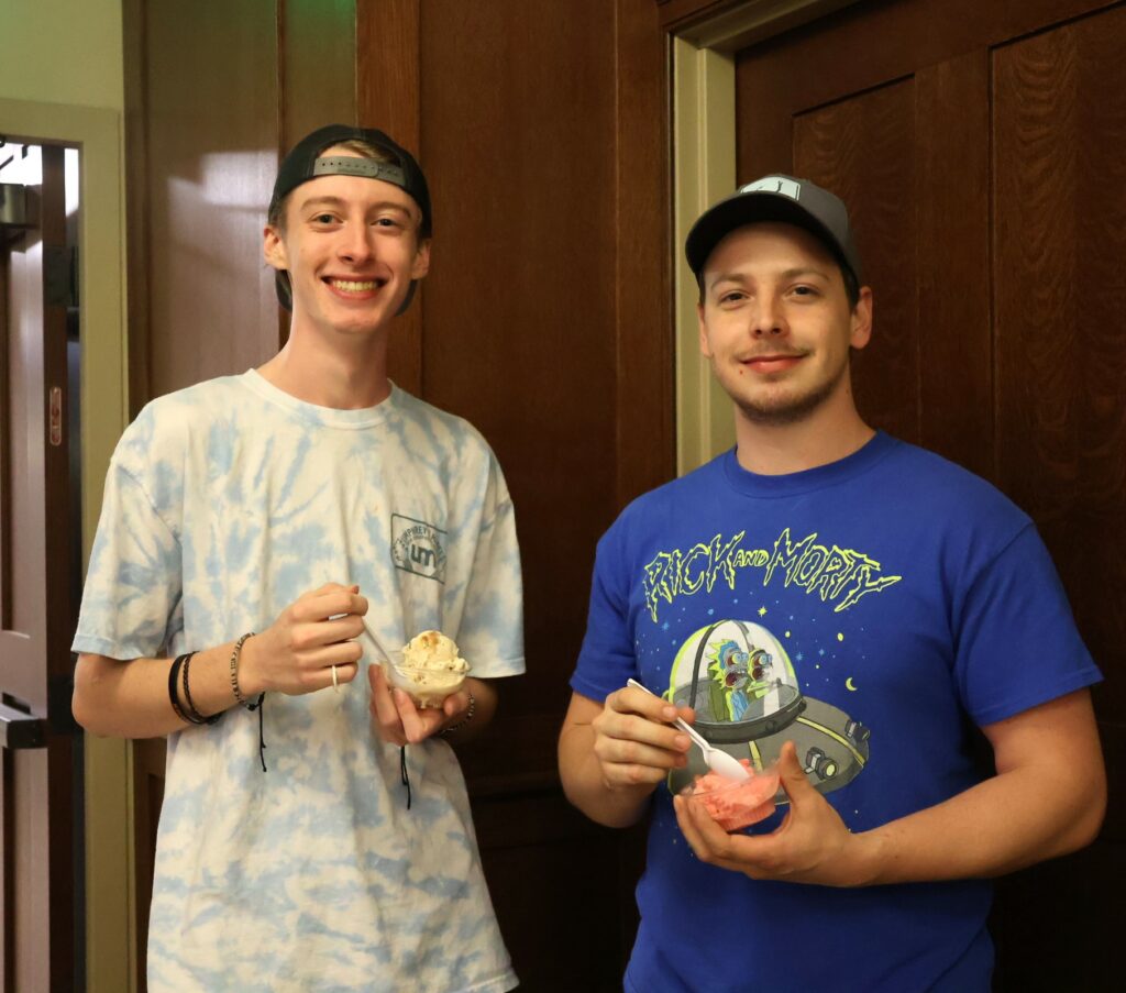 Two students enjoy some ice cream.