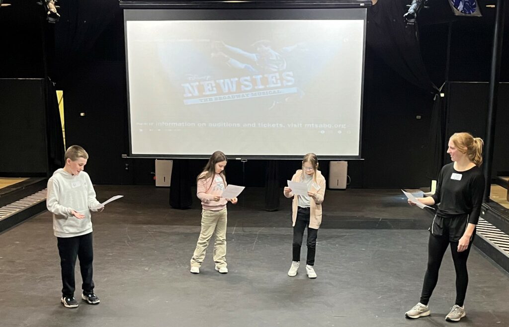 Potential cast members audition for "Newsies."