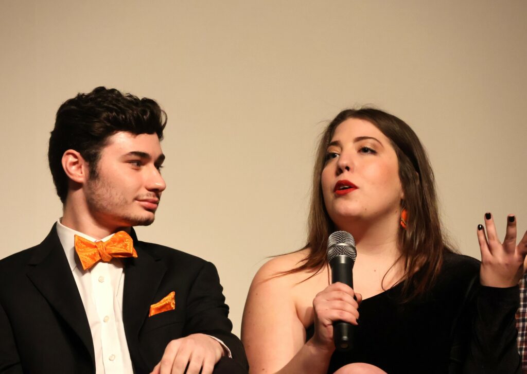 Josie Norton, right, speaks as Todd Wallin listens.