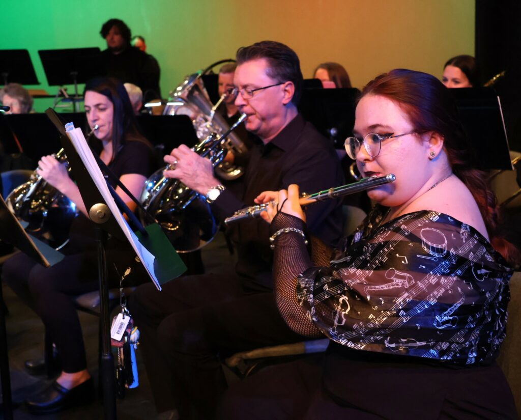 Three band members play before the concert starts.