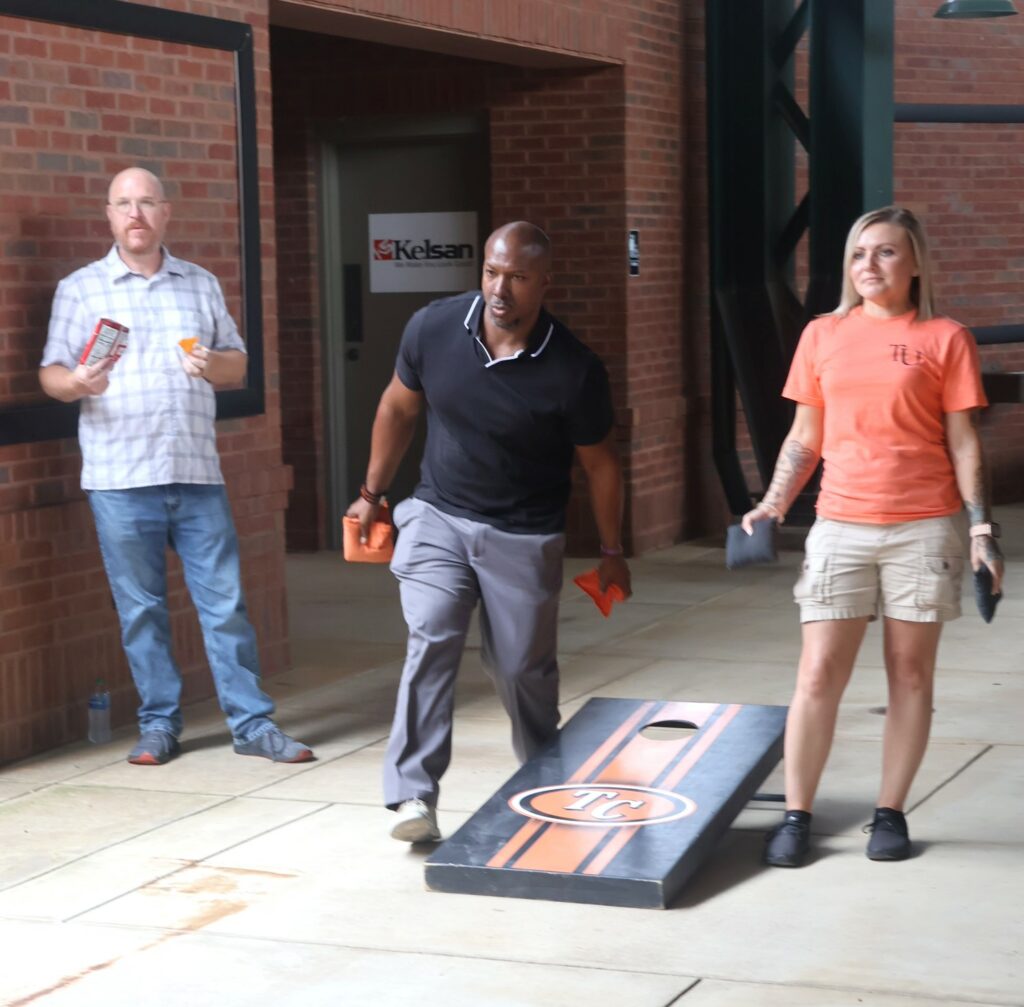 Chuck Sutton tosses a cornhole bag.