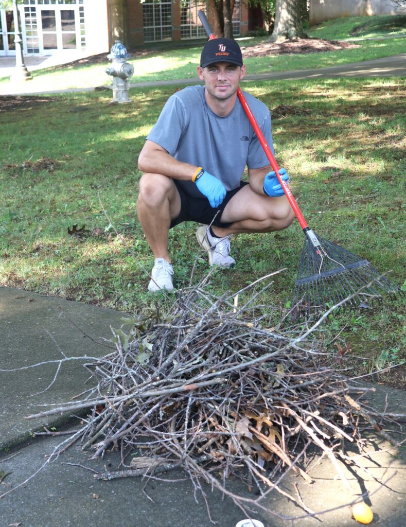 An employees shows some of the work achieved at Community Work Day.
