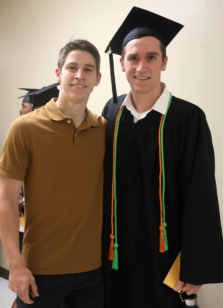 Graduate David Bowlin, left, and his brother pose before the ceremony.